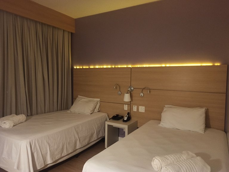 Stay Inn vista livre, piscina e ao lado da praia